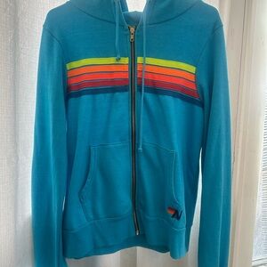 Aviator Nation Blue Hoodie with neon Rainbow Stripes